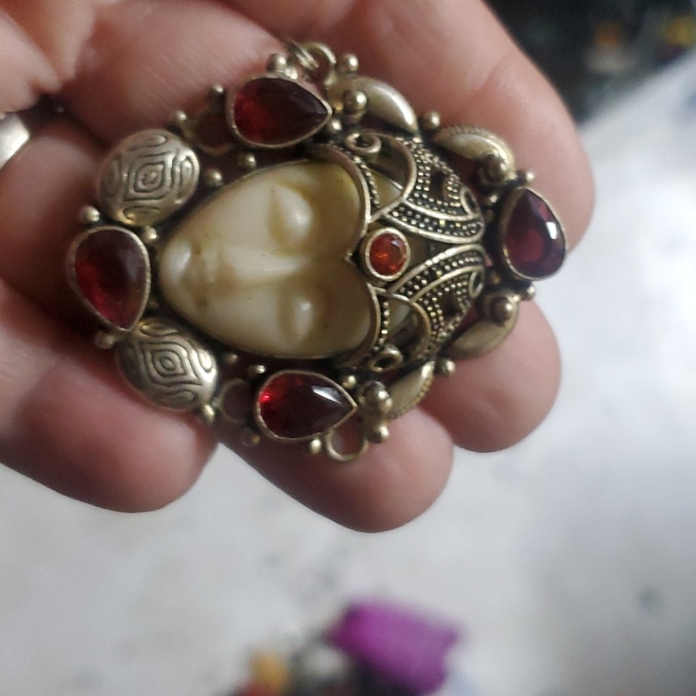 Sterling silver carved bovine bone and garnet pend